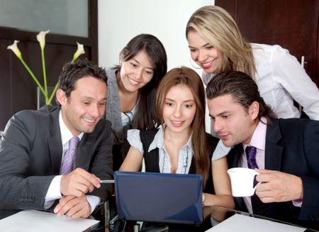 Group of business people on a laptop in an office