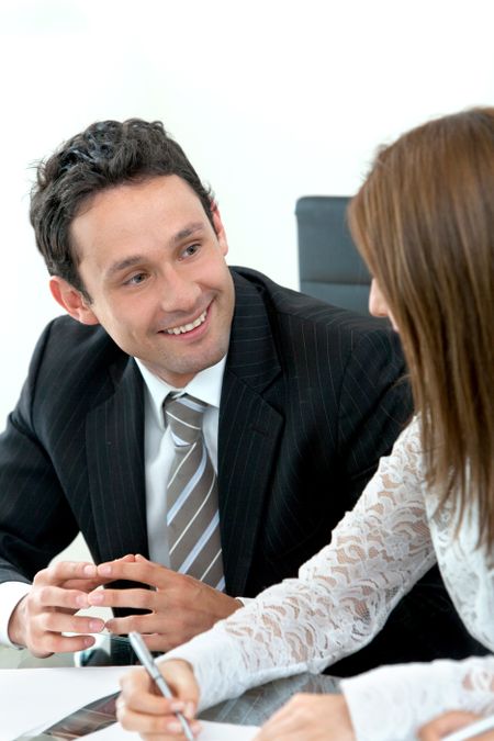 Businessman with his partner smiling in an office