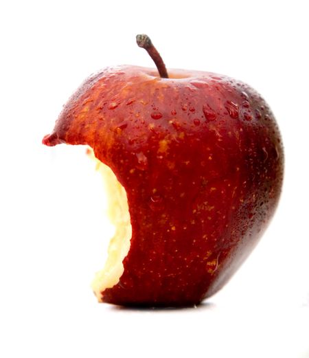 apple in red half beaten isolated over a white background