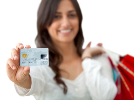 Woman shooping with credit card - focus on hand isolated on white