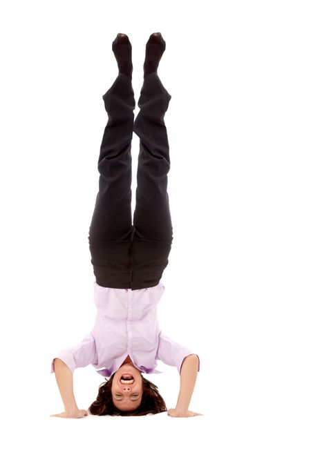 Happy woman in headstand isolated on white