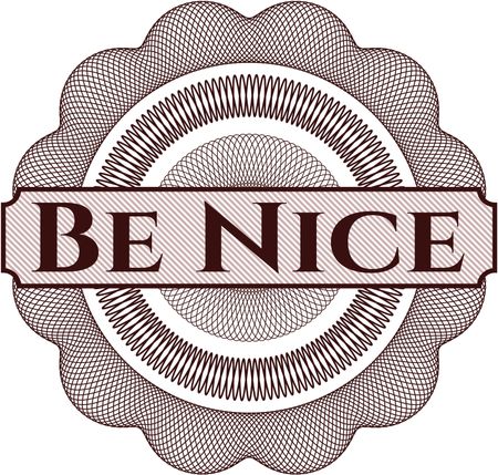 Be Nice written inside rosette