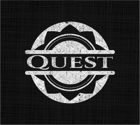 Quest chalkboard emblem written on a blackboard