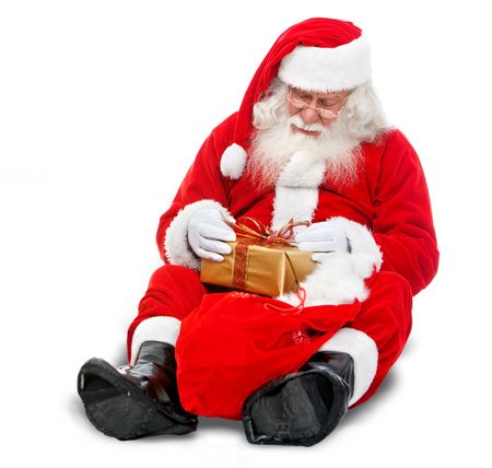 Santa with a Christmas gift isolated over a whte background