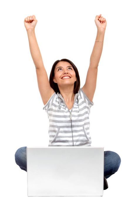 Excited woman with a laptop isolated over a white background
