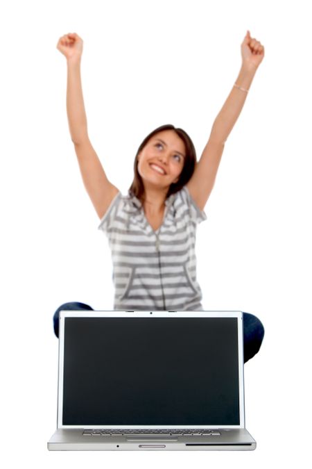 Excited woman with a laptop isolated over a white background