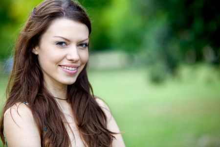 Portrait of a beautiful woman outdoors smiling