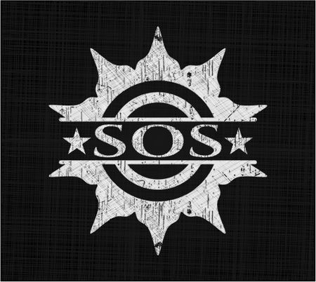 SOS chalkboard emblem written on a blackboard