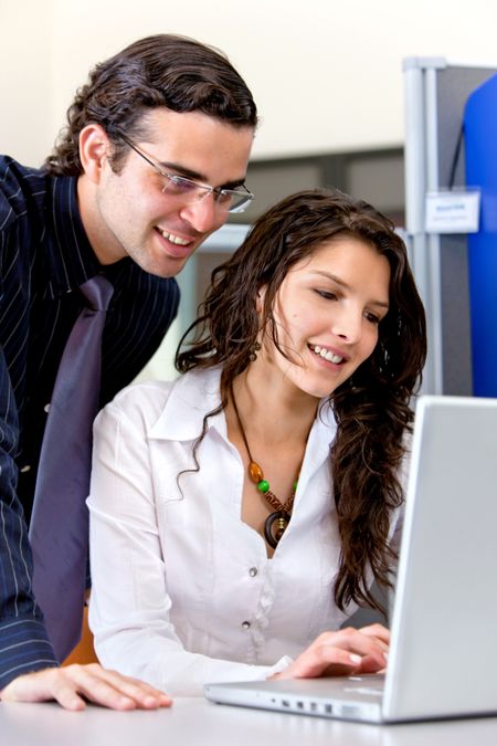 Business people working with a laptop indoors