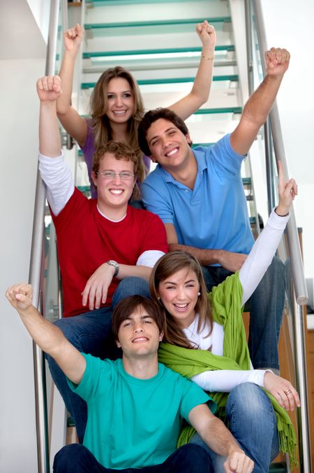 group of excited friends smiling at home