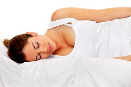 Beautiful woman sleeping over a white pillow