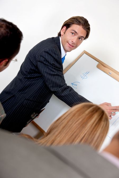 Businessman in an office showing the development of a company on a graph