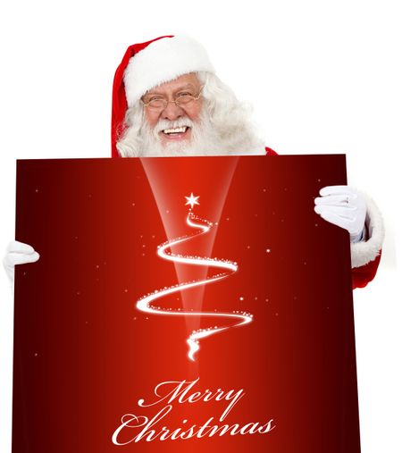 Santa holding a Christmas poster isolated over a white background
