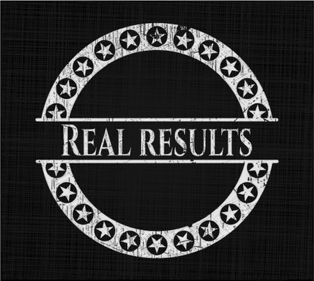 Real results chalk emblem written on a blackboard
