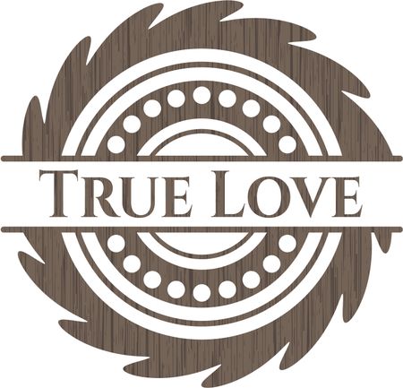 True Love badge with wood background