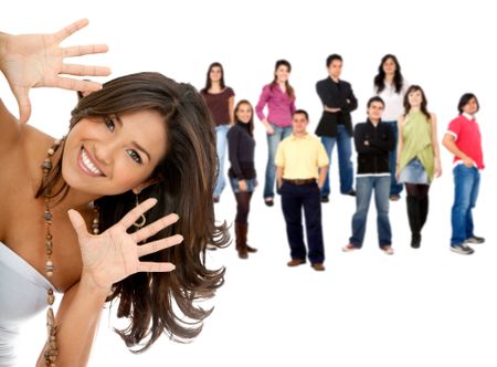 Beautiful happy woman portrait framing her face with a group of people behind isolated over a white background