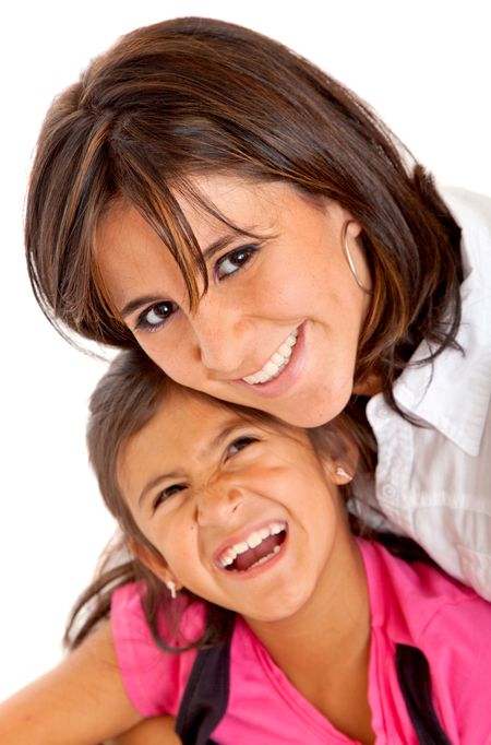 Mother and daughter smiling isolated over a white background