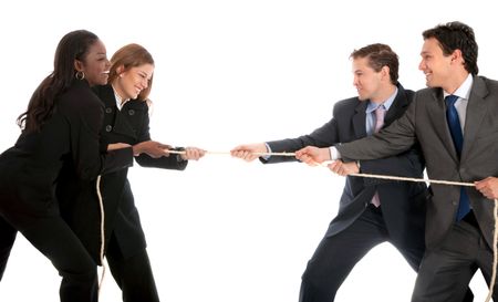 Businesswomen pulling a rope against some businessmen isolated on white