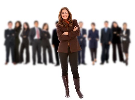 Business woman smiling with her team behind her - isolated over white