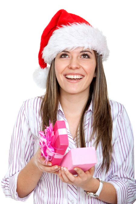 Female with a Santa hat holding a gift isolated over a white background