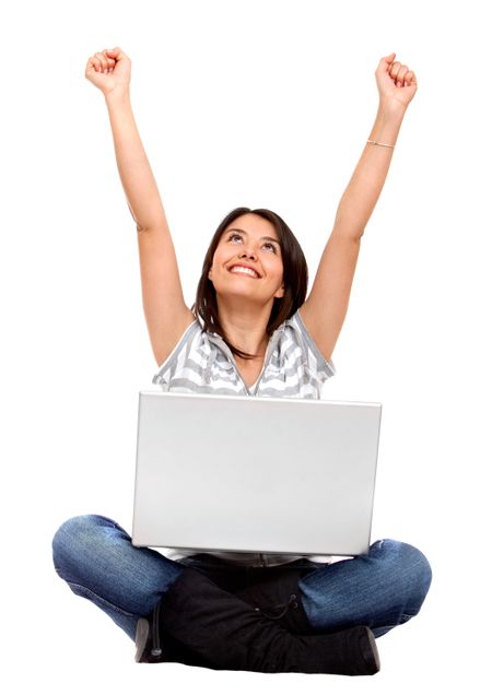 casual success girl on a laptop - isolated over a white background