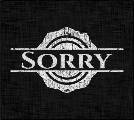 Sorry chalkboard emblem written on a blackboard