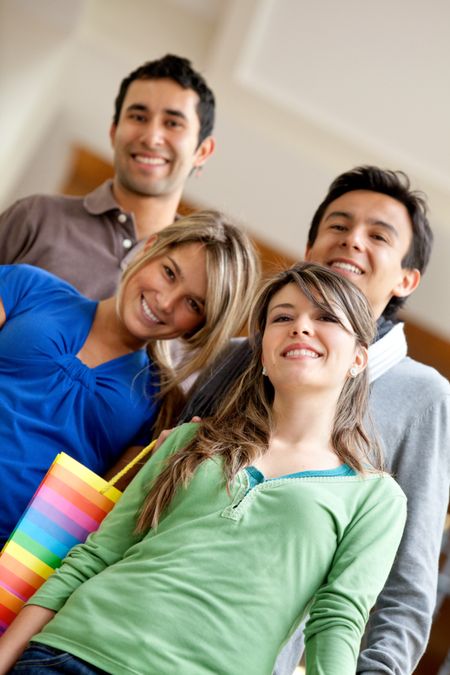 Group of young people with shopping bags