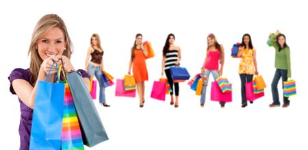 Happy girls with shopping bags isolated on white