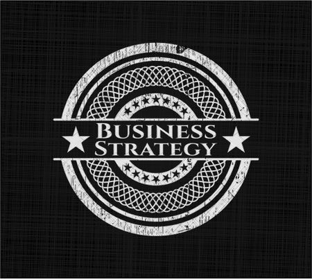 Business Strategy chalk emblem written on a blackboard