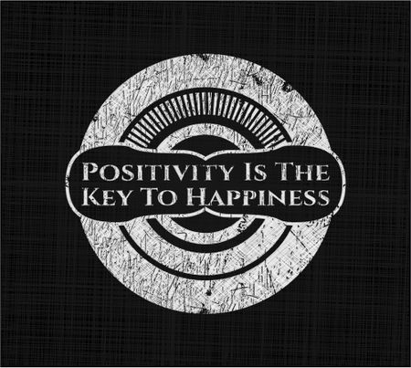 Positivity Is The Key To Happiness on chalkboard