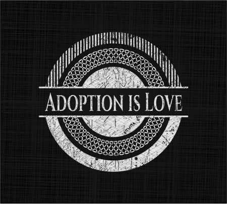 Adoption is Love written on a chalkboard