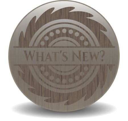 What's New? badge with wood background