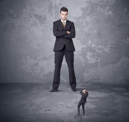 Big angry boss looking at tiny coworker concept on background