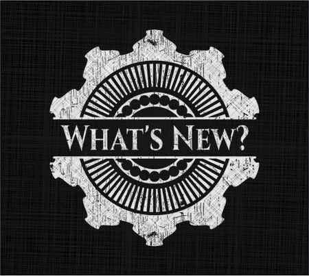 What's New? chalkboard emblem on black board