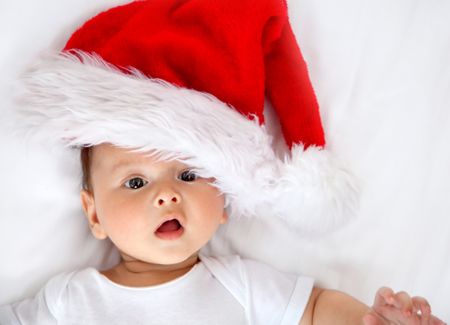 Christmas portrait of a baby boy with Santa hat