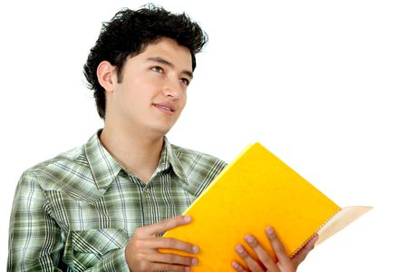 Handsome student looking up with a notebook isolated on white