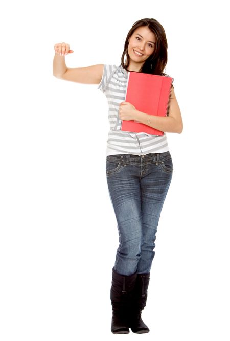 Beautiful female student leaning over an imaginary object isolated on white