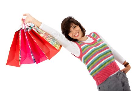 Woman with shopping bags isolated over a white background