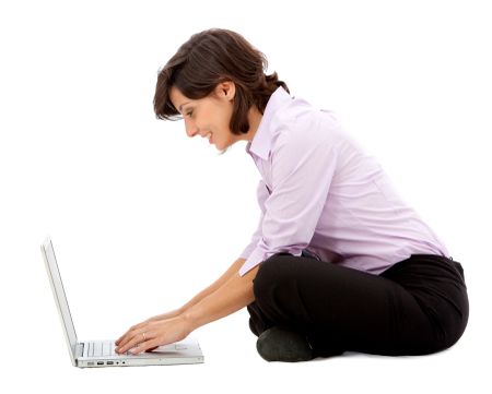 Business woman with a laptop isolated over a white background