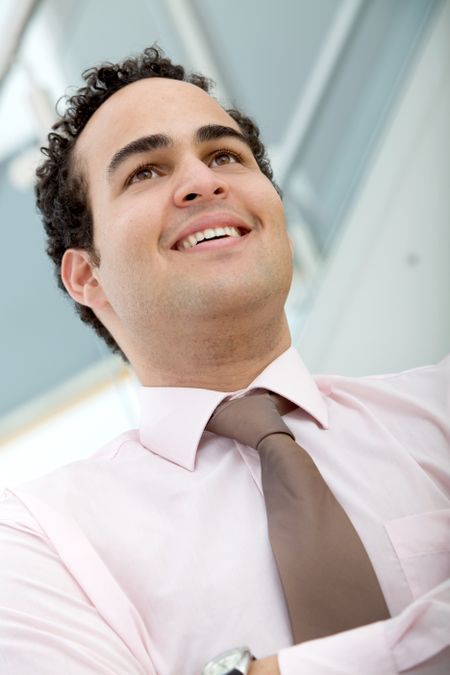 Confident business man smiling at the office