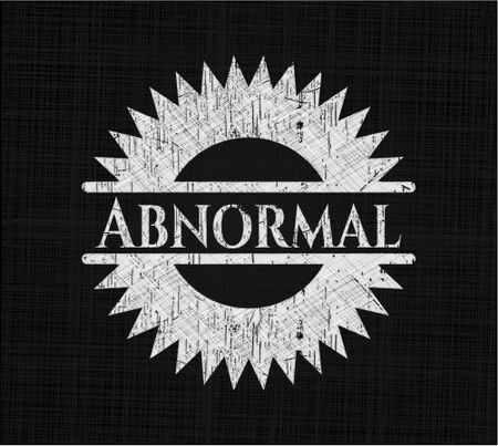 Abnormal chalkboard emblem written on a blackboard