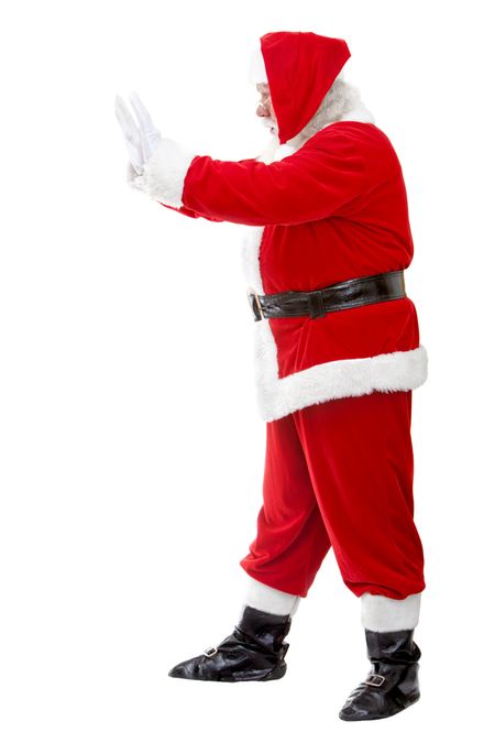 Santa Claus pushing something isolated over a white background