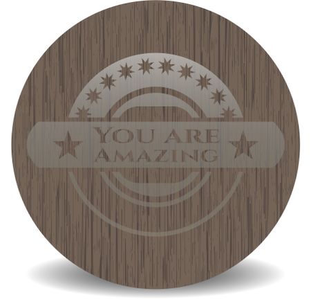 You are Amazing badge with wooden background