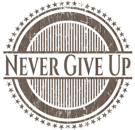 Never Give Up badge with wood background