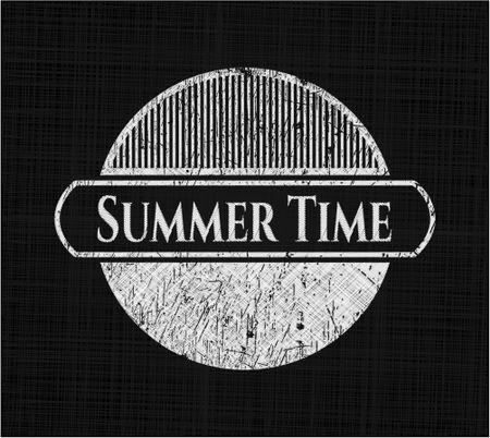 Summer Time chalk emblem written on a blackboard