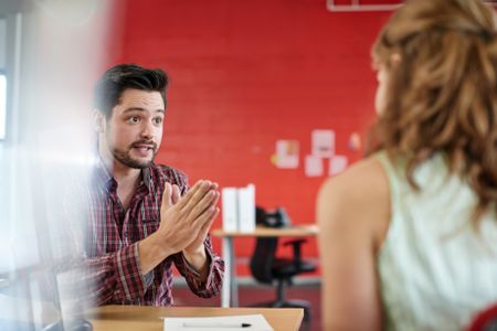 unposed-group-creative-business-people-open-418899799 Unposed group of creative business people in an open concept office brainstorming their next project.