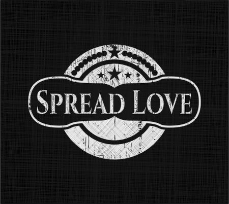 Spread Love chalkboard emblem written on a blackboard
