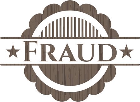 Fraud badge with wooden background