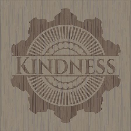 Kindness badge with wooden background