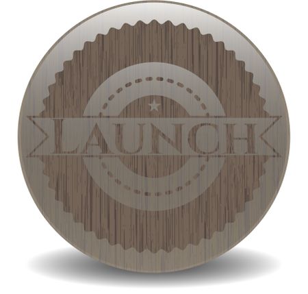 Launch badge with wood background